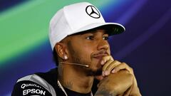 Hamilton takes Abu Dhabi pole ahead of title challenger Rosberg
