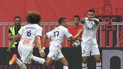 Marseille's Chilean forward Alexis Sanchez (C) celebrates with teammates after scoring a goal during the French L1 football match between OGC Nice and Olympique Marseille (OM) at the Allianz Riviera Stadium in Nice, south-eastern France, on August 28, 2022. (Photo by Valery HACHE / AFP) (Photo by VALERY HACHE/AFP via Getty Images)