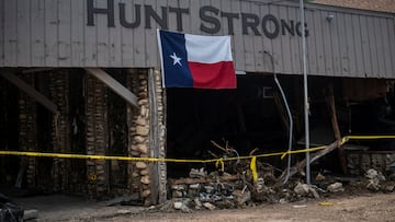 A Texas state flag hangs from the flood damaged Hunt Strong store in the aftermath of deadly flooding in Hunt, Texas, U.S., July 8, 2025. REUTERS/Sergio Flores