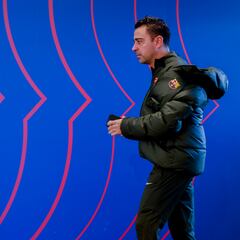 How many titles has Xavi won with Barcelona as a coach and as a player?