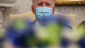 US President Joe Biden looks on during the weekly economic briefing in the Oval office of the White House in Washington, DC, on April 9, 2021. (Photo by JIM WATSON / AFP)