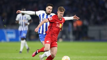 BERLIN, GERMANY - APRIL 08: Dani Olmo of RB Leipzig is challenged by Suat Serdar of Hertha BSC during the Bundesliga match between Hertha BSC and RB Leipzig at Olympiastadion on April 08, 2023 in Berlin, Germany. (Photo by Maja Hitij/Getty Images)