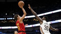 Mar 26, 2019; New Orleans, LA, USA; Atlanta Hawks guard Trae Young (11) shoots over New Orleans Pelicans center Julius Randle (30) during the first quarter at the Smoothie King Center. Mandatory Credit: Derick E. Hingle-USA TODAY Sports