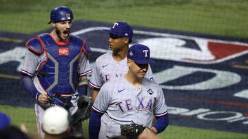 PHOENIX, ARIZONA - OCTOBER 31: Jonah Heim #28, Jos� Leclerc #25, and Nathaniel Lowe #30 of the Texas Rangers celebrate after beating the Arizona Diamondbacks 11-7 during Game Four of the World Series at Chase Field on October 31, 2023 in Phoenix, Arizona. Jamie Squire/Getty Images/AFP (Photo by JAMIE SQUIRE / GETTY IMAGES NORTH AMERICA / Getty Images via AFP)