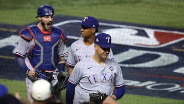 PHOENIX, ARIZONA - OCTOBER 31: Jonah Heim #28, Jos� Leclerc #25, and Nathaniel Lowe #30 of the Texas Rangers celebrate after beating the Arizona Diamondbacks 11-7 during Game Four of the World Series at Chase Field on October 31, 2023 in Phoenix, Arizona.   Jamie Squire/Getty Images/AFP (Photo by JAMIE SQUIRE / GETTY IMAGES NORTH AMERICA / Getty Images via AFP)