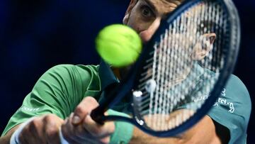 Serbia's Novak Djokovic returns to Italy's Jannik Sinner during their round-robin match on day 3 of the ATP Finals tennis tournament in Turin on November 14, 2023. (Photo by Tiziana FABI / AFP)