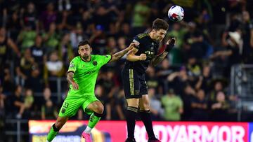 August 2, 2023; Los Angeles, CA, USA; Los Angeles FC midfielder Ryan Hollingshead (24) plays for the ball against FC Juarez midfielder Aitor Garcia (33) during the first half at BMO Stadium. Mandatory Credit: Gary A. Vasquez-USA TODAY Sports