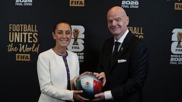 This handout picture released by the Mexican Presidency shows Mexico's President Claudia Sheinbaum (L) and FIFA President Gianni Infantino (R) posing for a photo with a ball during the draw for the 2026 FIFA Football World Cup taking place in the US, Canada and Mexico, at the Kennedy Center, in Washington, DC, on December 5, 2025. (Photo by Handout / Mexican Presidency / AFP) / RESTRICTED TO EDITORIAL USE - MANDATORY CREDIT "AFP PHOTO / MEXICAN PRESIDENCY" - HANDOUT - NO MARKETING NO ADVERTISING CAMPAIGNS - DISTRIBUTED AS A SERVICE TO CLIENTS