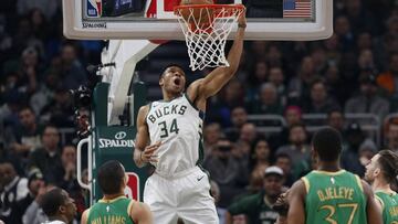 Jan 16, 2020; Milwaukee, Wisconsin, USA;  Milwaukee Bucks forward Giannis Antetokounmpo (34) makes a basket against the Boston Celtics during the second quarter at Fiserv Forum. Mandatory Credit: Jeff Hanisch-USA TODAY Sports