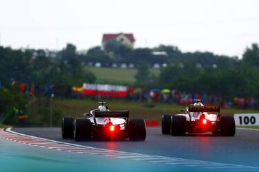 Hamilton leads Mercedes one-two at sodden Hungaroring