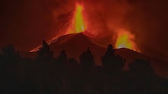 In this handout photograph taken and released by the Spanish Military Emergency Unit (UME) on November 1, 2021, the Cumbre Vieja volcano is still spewing lava and ash, at night, on the Canary island of La Palma.