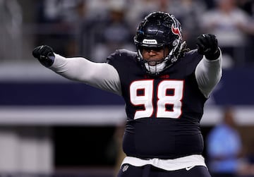 Tim Settle Jr. of the Houston Texans celebrates after sacking Cooper Rush of the Dallas Cowboys during the fourth quarter.