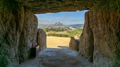 view out of the entrance of the Dolmen de Menga in Antequera