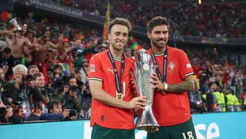 MUNICH, GERMANY - JUNE 08: Diogo Jota of Portugal and Ruben Neves pose for a photograph with the UEFA Nations League trophy after his team's victory in the UEFA Nations League 2025 final match between Portugal and Spain at Munich Football Arena on June 08, 2025 in Munich, Germany. (Photo by Maja Hitij - UEFA/UEFA via Getty Images)