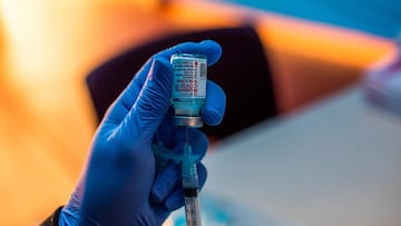 Medical workers load syringes with the Moderna Covid-19 vaccine to be administered by nurses at a vaccination site at Kedren Community Health Center, in South Central Los Angeles, California.
