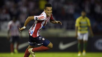 Colombia's Atletico Junior player Luis Diaz (R) celebrates after scoring against Argentina's Defensa y Justicia during a Copa Sudamericana