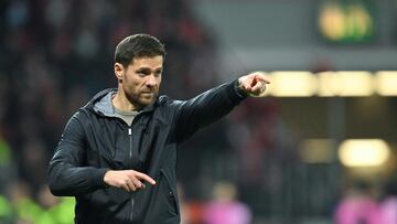 (FILES) Bayer Leverkusen's Spanish coach Xabi Alonso reacts from the sidelines after the 3-1 goal during the UEFA Europa League Group H football match between Bayer 04 Leverkusen and Qarabag FK in Leverkusen, western on October 26, 2023. In the space of a year on the banks of the Rhine, the Spaniard Xabi Alonso earned his coaching stripes in Leverkusen with a style of play based on a certain freedom granted to his players. To celebrate his 42nd birthday on November 25, 2023, Xabi Alonso would like to get another little dose of victory on the pitch at Werder Bremen's Weserstadion. (Photo by INA FASSBENDER / AFP)