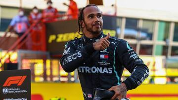 Mercedes&#039; British driver Lewis Hamilton celebrates winning the Tuscany Formula One Grand Prix at the Mugello circuit in Scarperia e San Piero on September 13, 2020. (Photo by Bryn Lennon / POOL / AFP)