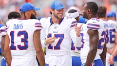 Josh Allen #17 of the Buffalo Bills laughs with Gabe Davis #13 and Latavius Murray #28