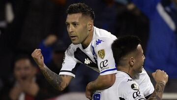 Velez Sarsfield's Lucas Janson (Top) celebrates with teammate Francisco Ortega after scoring against Talleres de Cordoba during the Copa Libertadores football tournament quarterfinals all-Argentine first leg match at the Jose Amalfitani stadium in Buenos Aires, on August 3, 2022. (Photo by JUAN MABROMATA / AFP)