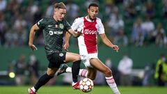 LISBON, PORTUGAL - SEPTEMBER 15: Nuno Santos of Sporting CP runs with the ball under pressure from Noussair Mazraoui of AFC Ajax during the UEFA Champions League group C match between Sporting CP and AFC Ajax at Estadio Jose Alvalade on September 15, 2021