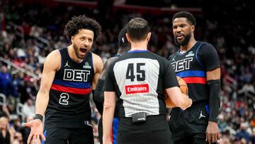 Cade Cunningham #2, Dennis Schroder #17 and Malik Beasley #5 of the Detroit Pistons react against referee Brian Forte #45 during the third quarter against the Oklahoma City Thunder at Little Caesars Arena on March 15, 2025 in Detroit, Michigan.