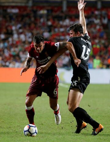 Coutinho and Salah hit the spot as Liverpool lift Premier League Asia Trophy - in pictures