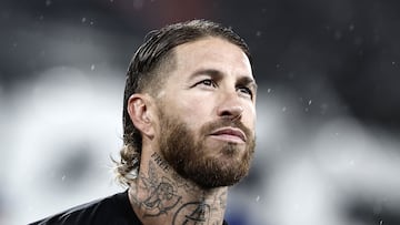 (FILES) Sevilla's Spanish defender #04 Sergio Ramos listens to the national anthem before the Champions League football match between RC Lens and Sevilla at the Stade Bollaert-Delelis in Lens, northern France, on December 12, 2023. Spanish football player Sergio Ramos is the new signing of Rayados de Monterrey of Mexico's La Liga, the club announced on its social networks on February 6, 2025, with a message in which it highlighted the Spaniard as a �historic defender� in world football. (Photo by Sameer Al-Doumy / AFP)