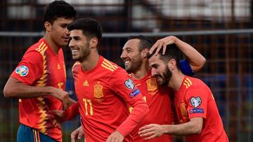 Spain's defender Jose Luis Gaya (R) celebrates with Spain's midfielder Santi Cazorla and Spain's forward Marco Asensio after scoring during the UEFA Euro 2020 group F qualifying football match between Faroe Islands and Spain at the Trosvoll