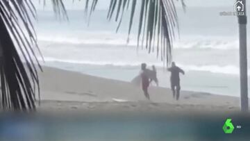 Cómo sacó un policía a un surfista de la playa