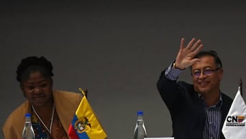 Colombian president-elect Gustavo Petro (R) waves next to his running mate Francia Marquez on arrival at the headquarters of the National Registry of Civil Status to receive their official credentials as president and vice-president respectively, in Bogota on June 23, 2022. - Petro, who became the country's first ever left-wing president after getting 50.44 percent of the vote in the runoff election, has promised to invest in healthcare and education, increase taxes on the wealthiest and suspend oil exploration, giving pride of place to renewable energy sources. (Photo by Juan BARRETO / AFP) (Photo by JUAN BARRETO/AFP via Getty Images)