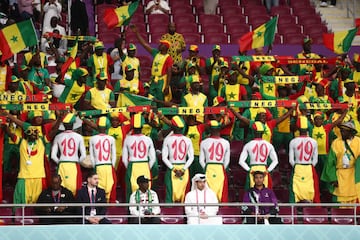 DOHA, QATAR - NOVEMBER 29:  Fans of Senegal painted with the number 19 during the FIFA World Cup Qatar 2022 Group A match between Ecuador and Senegal at Khalifa International Stadium on November 29, 2022 in Doha, Qatar. (Photo by James Williamson - AMA/Getty Images)