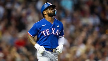 Oct 30, 2023; Phoenix, AZ, USA; Texas Rangers right fielder Adolis Garcia (53) reacts after after suffering an injury in the eighth inning of game three of the 2023 World Series against the Arizona Diamondbacks at Chase Field. Mandatory Credit: Mark J. Rebilas-USA TODAY Sports