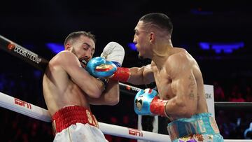 NEW YORK, NEW YORK - DECEMBER 10: Teofimo Lopez punchesSandor Martin during their junior welterweight bout at Madison Square Garden on December 10, 2022 in New York City.   Al Bello/Getty Images/AFP (Photo by AL BELLO / GETTY IMAGES NORTH AMERICA / Getty Images via AFP)