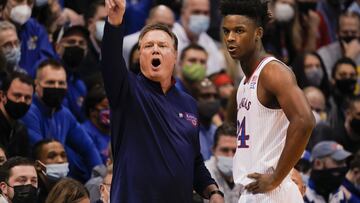 Head coach Bill Self of the Kansas Jayhawks calls a play while conversing with K.J. Adams #24 of the Kansas Jayhawks.