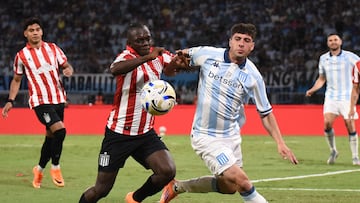 Estudiantes' Colombian forward #18 Edwuin Cetre and Racing's midfielder #05 Juan Ignacio Nardoni fight for the ball during the Argentine Professional Football League 2025 Clausura Tournament final match between Racing and Estudiantes at the Madre de Ciudades stadium in Santiago del Estero, Argentina on December 13, 2025. (Photo by Luis Santillan / AFP)