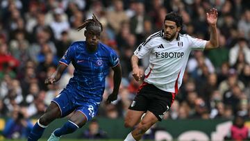 Chelsea's English defender #23 Trevoh Chalobah (L) vies with Fulham's Mexican striker #07 Raul Jimenez (R) during the English Premier League football match between Fulham and Chelsea at Craven Cottage in London on April 20, 2025. (Photo by Glyn KIRK / AFP) / RESTRICTED TO EDITORIAL USE. No use with unauthorized audio, video, data, fixture lists, club/league logos or 'live' services. Online in-match use limited to 120 images. An additional 40 images may be used in extra time. No video emulation. Social media in-match use limited to 120 images. An additional 40 images may be used in extra time. No use in betting publications, games or single club/league/player publications. /