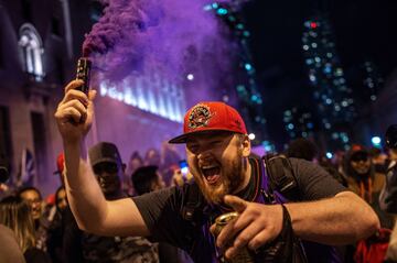 Toronto Raptors fans celebrate their win in the NBA championships in downtown Toronto