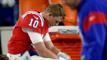 FOXBORO, MA - December 2:  Mac Jones #10 of the New England Patriots sits on the bench after losing 24-10 against the Buffalo Bills at Gillette Stadium on December 2, 2022 in Foxboro, Massachusetts. (Photo by Matt Stone/MediaNews Group/Boston Herald via Getty Images)