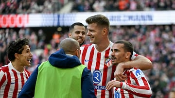 Atletico Madrid's French forward #07 Antoine Griezmann celebrates scoring his team's second goal with Atletico Madrid's Norwegian forward #09 Alexander Sorloth and Atletico Madrid's Argentine forward #20 Giuliano Simeone (L) during the Spanish league football match between Club Atletico de Madrid and Valencia CF at Metropolitano Stadium in Madrid on December 13, 2025. (Photo by Javier SORIANO / AFP)