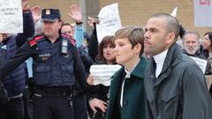 Prison workers unions' members protest over the killing of a cook by an inmate the week before, as convicted rapist and former Brazil international football player Dani Alves (R), flanked by his lawyers Ines Guardiola, leaves Brians 2 prison in Barcelona on March 25, 2024. Convicted rapist and former Brazil international Dani Alves left a jail in Barcelona on March 25, 2024 after posting the one-million-euro bail set by a Barcelona court to ensure his release pending appeal. Ex-Brazil star has been sentenced to 4.5 years in jail for rape on February 22, 2024. (Photo by LLUIS GENE / AFP)