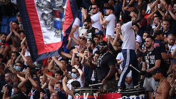 PSG fans cheer for their team during the friendly football match Paris Saint-Germain (PSG) vs Waasland-Beveren at the Parc des Princes stadium in Paris on July 17, 2020. (Photo by Anne-Christine POUJOULAT / AFP)