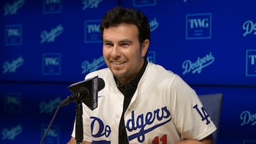 Sep 17, 2025; Los Angeles, California, USA; Formula 1 driver and six-time Grand Prix winner Sergio “Checo” Perez answers questions during a news conference prior to the game between the Los Angeles Dodgers and the Philadelphia Phillies at Dodger Stadium. Mandatory Credit: Jayne Kamin-Oncea-Imagn Images