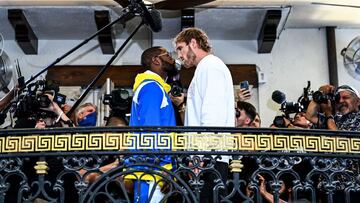 Former world welterweight king Floyd Mayweather (L) and YouTube personality Logan Paul face-off during the media availability ahead of their June 6 exhibition boxing match, on June 3, 2021 at Villa Casa Casuarina at the former Versace Mansion in Miami Bea