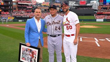 ST LOUIS, MO - MAY 07: President of baseball operations John Mozeliak and Adam Wainwright #50 of the St. Louis Cardinals pose with Miguel Cabrera #24 of the Detroit Tigers for a photo with a framed picture of Caberera's 400th home run in recognition of his final year playing in MLB prior to a game between the St. Louis Cardinals and the Detroit Tigers at Busch Stadium on May 7, 2023 in St Louis, Missouri.   Joe Puetz/Getty Images/AFP (Photo by Joe Puetz / GETTY IMAGES NORTH AMERICA / Getty Images via AFP)