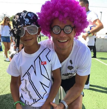 Cristiano enjoys the Real Madrid BBQ with his son.