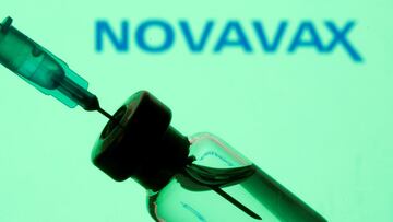 FILE PHOTO: A vial and sryinge are seen in front of a displayed Novavax logo in this illustration taken January 11, 2021. REUTERS/Dado Ruvic/Illustration/File Photo