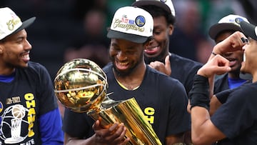 BOSTON, MASSACHUSETTS - JUNE 16: Andrew Wiggins #22 of the Golden State Warriors celebrates with th Larry O'Brien Championship Trophy after defeating the Boston Celtics 103-90 in Game Six of the 2022 NBA Finals at TD Garden on June 16, 2022 in Boston, Massachusetts. NOTE TO USER: User expressly acknowledges and agrees that, by downloading and/or using this photograph, User is consenting to the terms and conditions of the Getty Images License Agreement.   Elsa/Getty Images/AFP
== FOR NEWSPAPERS, INTERNET, TELCOS & TELEVISION USE ONLY ==