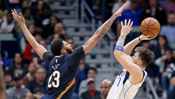 Dec 28, 2018; New Orleans, LA, USA; Dallas Mavericks forward Luka Doncic (77) has his shot defended by New Orleans Pelicans forward Anthony Davis (23) in the second half at the Smoothie King Center. Mandatory Credit: Chuck Cook-USA TODAY Sports