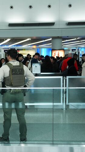 Immigration and Customs Enforcement (ICE) agents patrol at John F. Kennedy International Airport, New York City, U.S. March 23, 2026. Hundreds of Immigration and Customs Enforcement agents were ordered to deploy to airports to help fill TSA staffing gaps across the country. REUTERS/Adam Gray